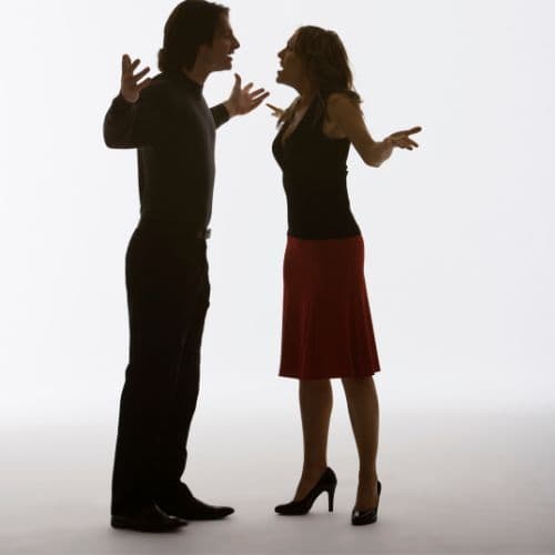 Two people in tense conversation, illustrating a difficult real estate situation